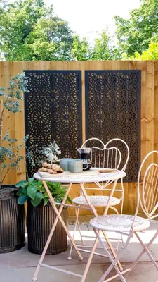 a patio with a table and chairs and a fence at Finest Retreats - Blackbarn Wood in Balsham