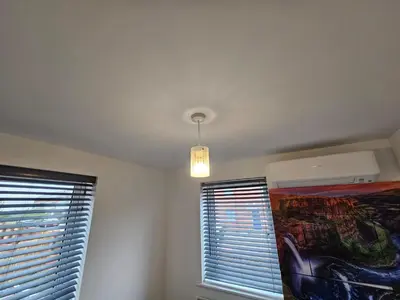 a room with two windows and a ceiling at Modern 3 Bedroom Town House in Ipswich