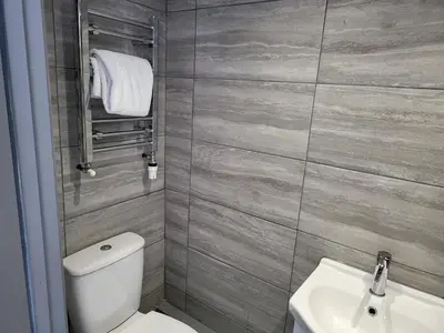 a bathroom with a toilet and a sink at Vetrelax Colchester Three bedroom house- Sleeps up to 7 - Free Wi-Fi - Contractors - Families - Long Term Stays in Colchester