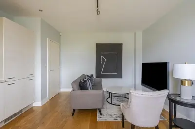 a living room with a couch and a table at Luxurious Private One Bedroom Apartment with Sky TV, Movies & Netflix in Braintree