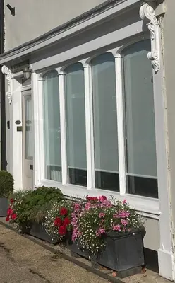 a house with some flowers in front of it at Blythe Cottage in Long Melford