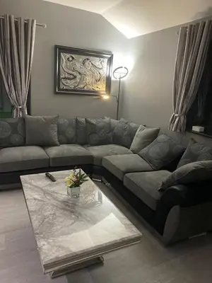 a living room with a couch and a coffee table at Belvedare-Suffolk in Sudbury