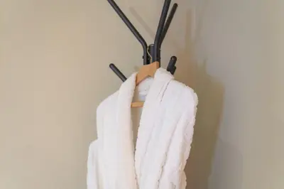 a towel hanging on a rack in a room at The Pier Hotel in Harwich
