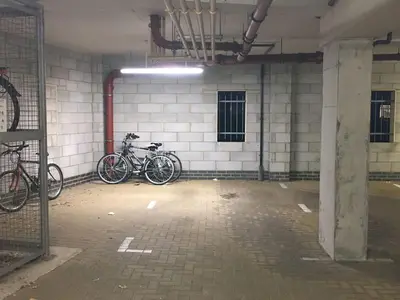 two bikes parked against a wall in a building at 2 BR flat next to Train Station & Gated Parking in Cambridge
