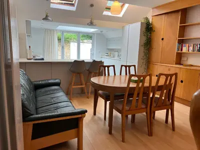 a kitchen and dining room with a table and chairs at 300m to Fitzwilliam museum 3 en-suites double bedroom Victoria house in Cambridge