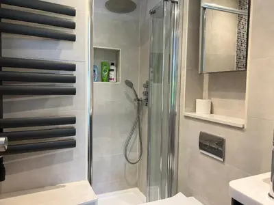a bathroom with a shower and a sink at 300m to Fitzwilliam museum 3 en-suites double bedroom Victoria house in Cambridge