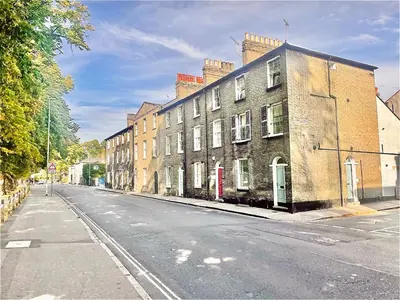 an empty street with buildings on the side of the road at EMMANUEL HOUSE - Beautiful 1-Bedroom Apt In Central Cambridge - Historical Building in Cambridge