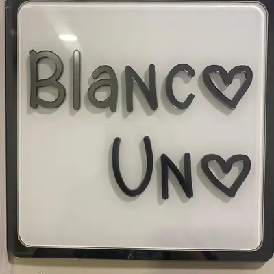 a sign for a pharmacy with two hearts on it at Blanco Uno in Colchester