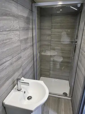 a bathroom with a sink and a shower at Colchester House with garden and parking- Sleeps up to 7 - Free Wi-Fi - Contractors - Families - Long Term Stays in Colchester