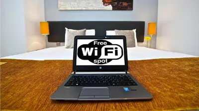 a laptop computer sitting on top of a bed at Colchester House with garden and parking- Sleeps up to 7 - Free Wi-Fi - Contractors - Families - Long Term Stays in Colchester