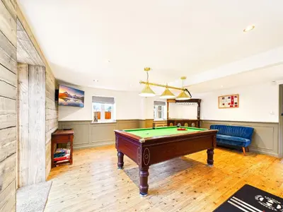 a living room with a pool table in it at Cottage In Norfolk Sleeps 23 - Private Pool, Fishing Lake, Hot Tub Ref 99008Sc in Hockham