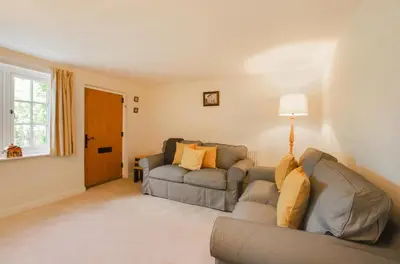 a living room with a couch and a window at 3 Bed in Yoxford oc-bmy in Yoxford