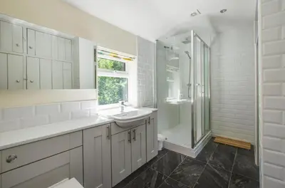 a white bathroom with a sink and a shower at 3 Bed in Yoxford oc-bmy in Yoxford