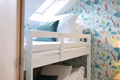 a bunk bed in a room with a mirror at The Red Brick House, Aldeburgh in Aldeburgh