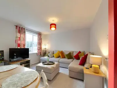 a living room with a couch and a tv at Pass the Keys Renovated Sunny Home Pass the Keys in Cambridge