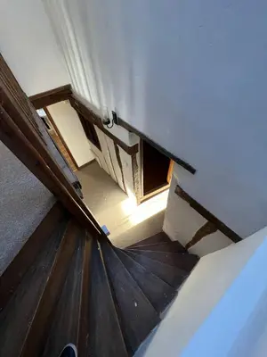 an overhead view of an attic room with an open door at 4 Bedroom townhouse on one of the oldest streets in Wymondham