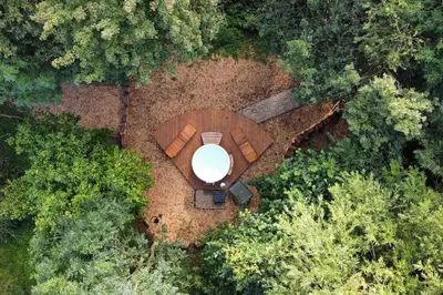 an aerial view of a circular table in the middle of a forest at The Hive - beautiful studio with amazing hot tub in Cratfield