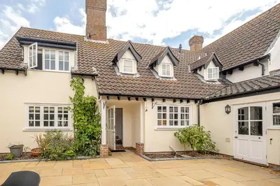 a white house with a roof at Stripe Cottage - Aldeburgh Coastal Cottages in Aldeburgh