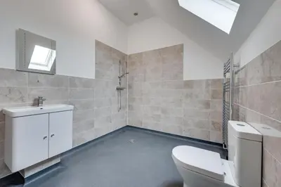 a bathroom with a toilet and a sink at 5 Bed in Aldeburgh oc-pops in Aldeburgh