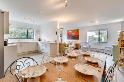 a dining room and kitchen with a table and chairs at 5 Bed in Aldeburgh oc-pops in Aldeburgh