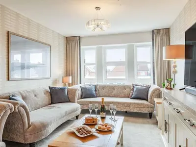 a living room with a couch and a table at Violet Place in Broomfield