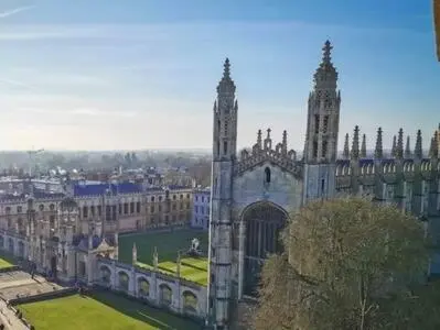 a large building with a clock tower in a city at City Center,2 Bedroom Apartment with Parking in Cambridge