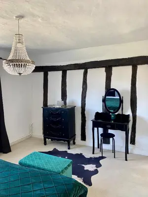 a room with a table and a mirror and a desk at Farmhouse Retreat with Hot Tub, Pool, Horses, Games Room, Free Car Park, Only 45 min from Oxford Circus in Stapleford Tawney
