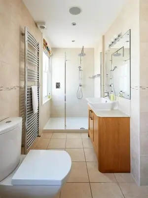 a bathroom with a toilet and a sink and a shower at 252 Aldeburgh Townhouse - Aldeburgh Coastal Cottages in Aldeburgh