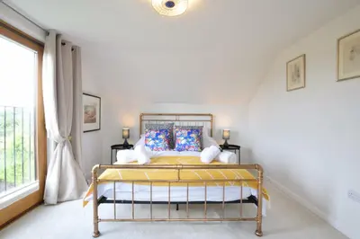 a bedroom with a bed and a window at Skelder, Parham in Parham