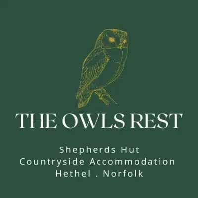 a bird sitting on a branch with the words the owls restratshitorgetown at The Owls Rest Shepherds Hut Hethel in Norwich