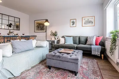 a living room with a couch and a chair at Martlet Cottage Aldeburgh in Aldeburgh