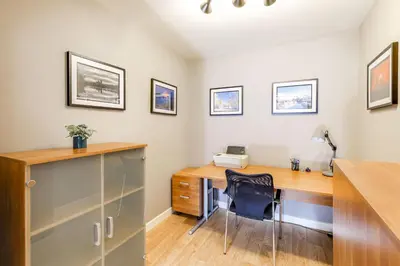 an office with a desk with a printer and a chair at The Old Warehouse Ely in Ely