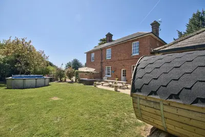 a house with a large yard in front of it at Harkstead Hall By Group Retreats in Ipswich
