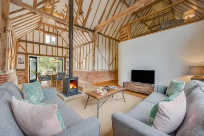a living room with two couches and a fireplace at 3 Bed in Kersey oc-tcbk in Kersey