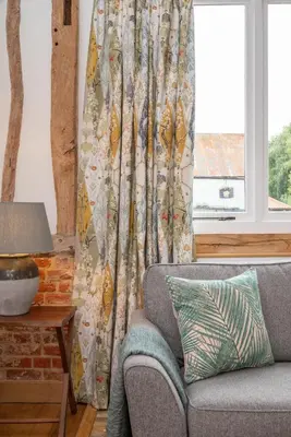 a living room with a couch and a window at 3 Bed in Kersey oc-tcbk in Kersey