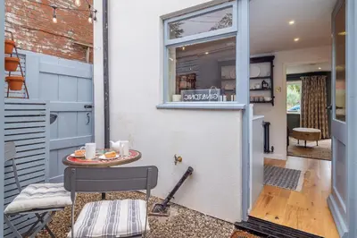 a small room with a table and a window at Tipple Cottage in Peasenhall