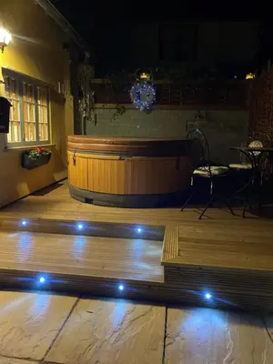 a stage with a wooden floor with lights on it at Vine Cottage in Walsham le Willows