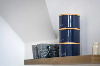 a blue vase sitting on top of a shelf at Secluded Island Retreat - in the heart of the Anchorage in West Mersea