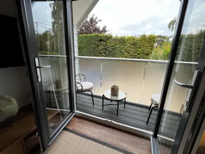 a balcony with two chairs and a table at Secluded Island Retreat - in the heart of the Anchorage in West Mersea