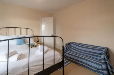 a bedroom with two bunk beds in a room at 40 Buller Road - Aldeburgh Coastal Cottages in Leiston