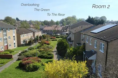 a row of houses with solar panels on their roofs at Town House Chantry - With Self Check In and Free Parking - Rooms at ipswichdigs in Ipswich