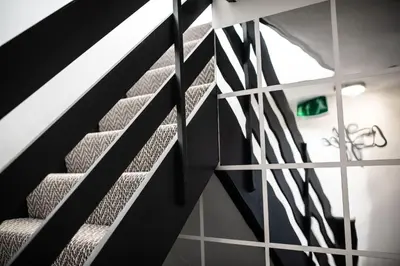 a set of stairs with a glass wall at Town House Chantry - With Self Check In and Free Parking - Rooms at ipswichdigs in Ipswich
