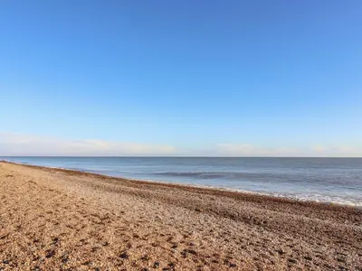 a sandy beach with the ocean in the background at Valetta, Thorpeness in Thorpeness