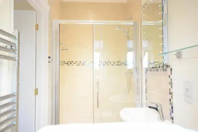 a bathroom with a shower and a sink at Red Robin, Whepstead in Whepstead