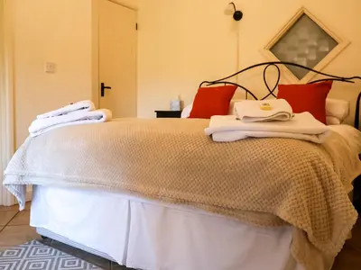 a bedroom with a bed with towels on it at Remus in Larling