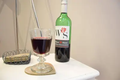 a bottle of wine next to a glass of wine at Pied a Mer, Aldeburgh in Aldeburgh