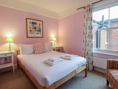 a bedroom with a bed with towels on it at Lavender House, Aldeburgh in Aldeburgh