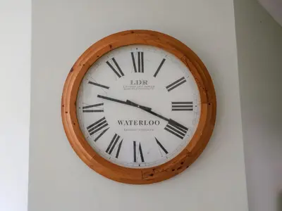 a clock that is on a wall at Lavender Cottage, Aldeburgh in Aldeburgh