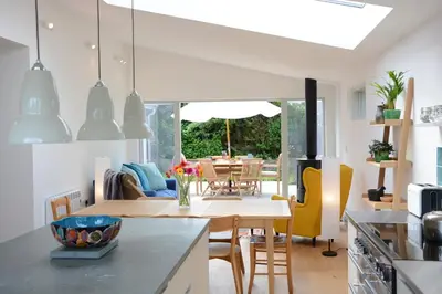 a kitchen and dining room with a table and chairs at 2 Pink Cottages, Aldeburgh in Aldeburgh