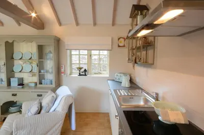 a kitchen with a sink and a counter top at The Nookery at Snape Hall in Snape